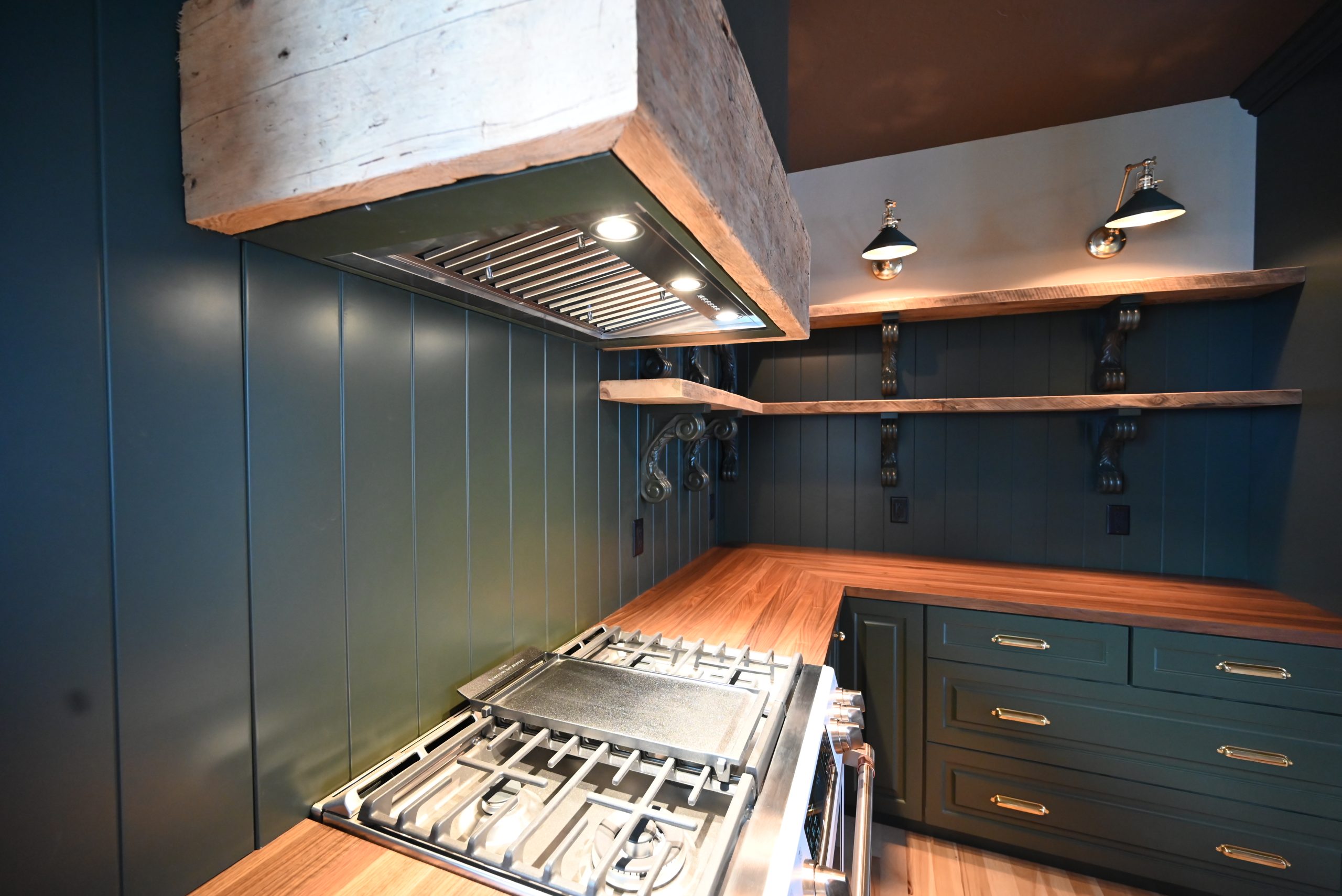 Range and open shelving detail in a Bartow Builders kitchen